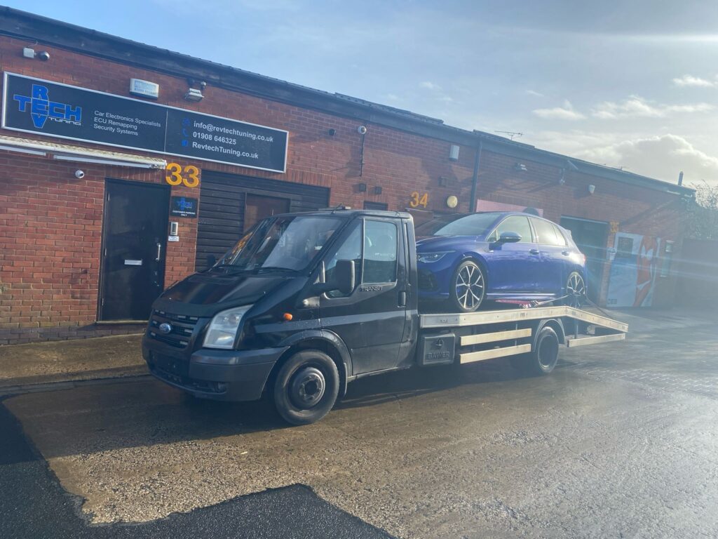 Tow truck safely transporting a customer’s vehicle during breakdown.”