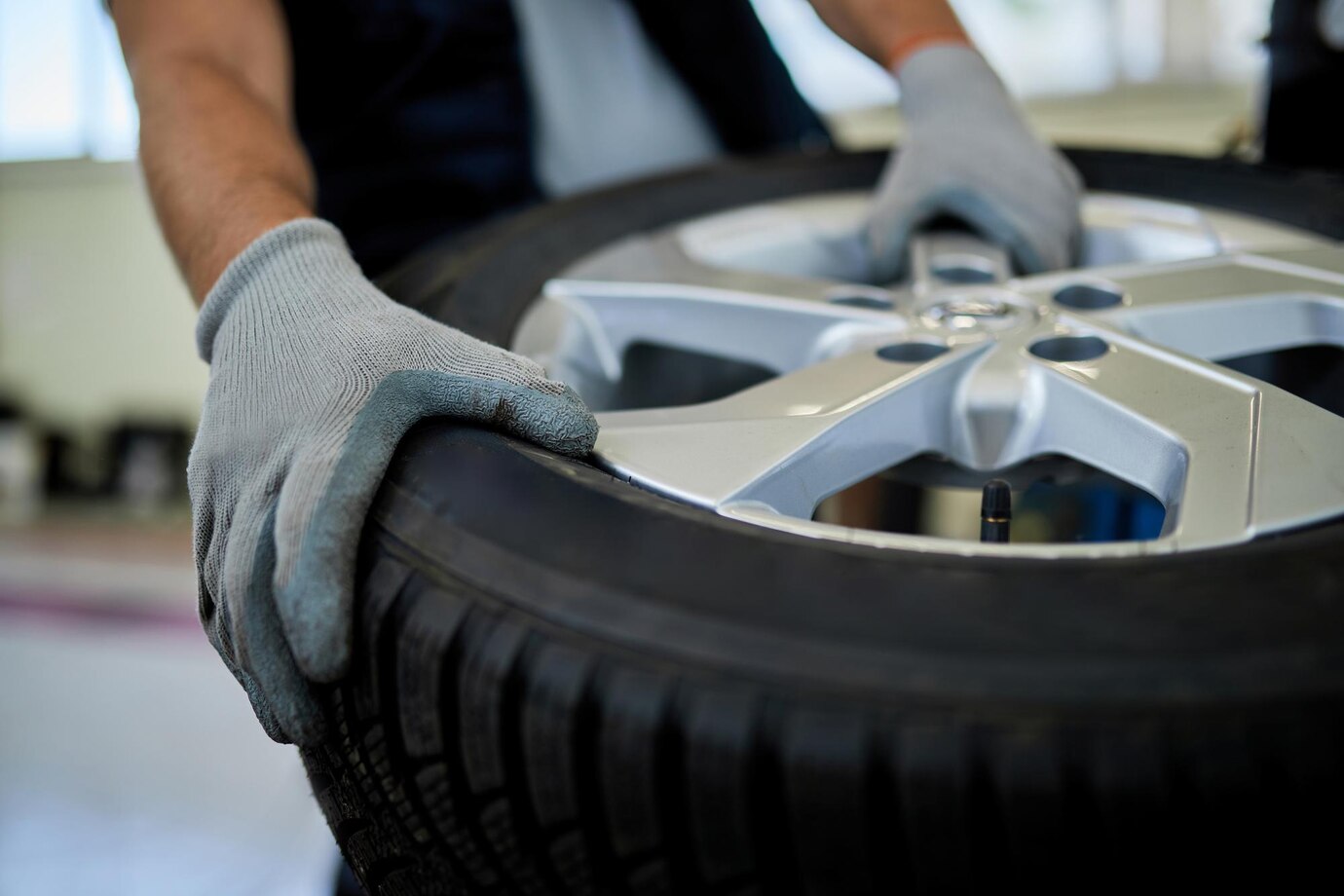 Roadside assistance team changing a flat tyre for a driver in need.
